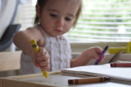 child with crayon